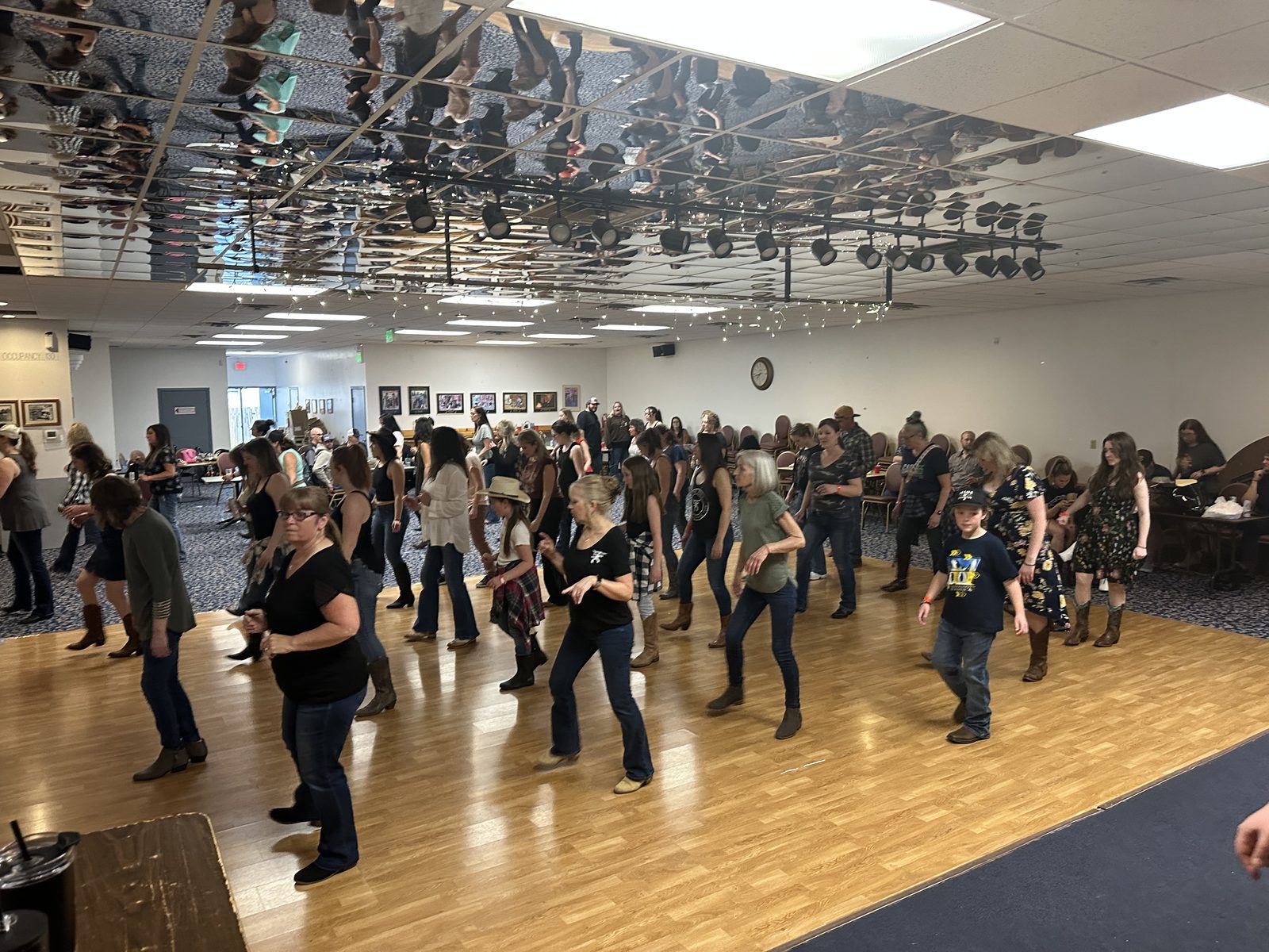 A full floor of dancers mid-lesson
