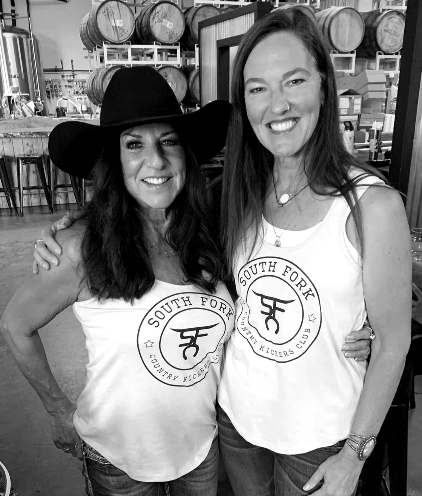 Two dancers wearing South Fork Country Kickers tanks