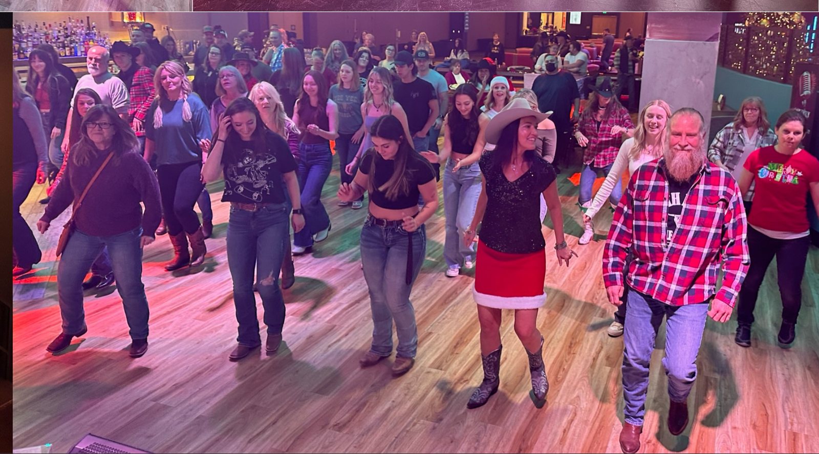 Dancers mid-step across the floor